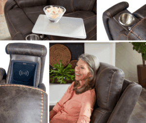 A woman smiles while reclining in the Titan Medium - Lift Chair by Golden Technologies, featuring a popcorn tray, built-in cup holder, and a wireless charging pad in the armrest.