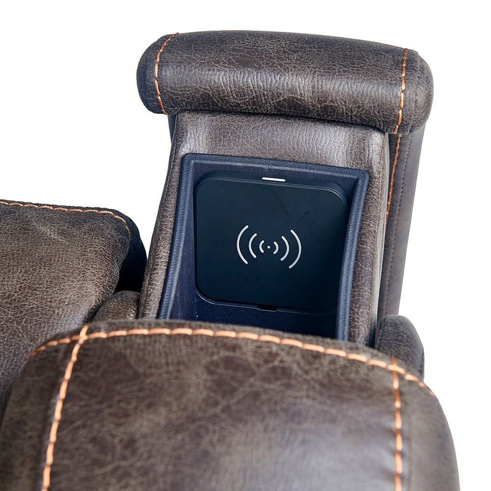 Close-up of the brown leather armrest with orange stitching on the Titan Medium - Lift Chair by Golden Technologies, featuring a built-in wireless charging pad in a compartment. Close-up of the brown leather armrest with orange stitching on the Titan Medium - Lift Chair by Golden Technologies, featuring a built-in wireless charging pad in a compartment.