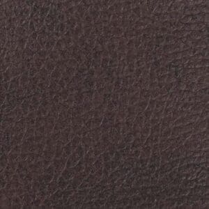 Close-up of dark brown textured leather, highlighting natural grain and subtle creases—ideal for the Rhea Medium - Lift Chair by Golden Technologies, a stylish and comfortable power recliner.