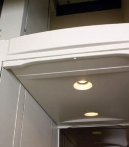 A close-up view of the interior ceiling of the Telecab Home Lift by Savaria, featuring recessed lights and smooth white panels crafted for modern home accessibility.