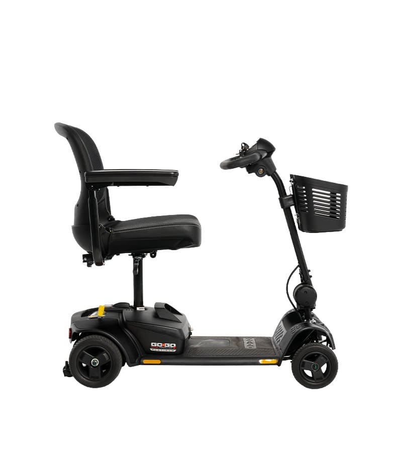 A black Go Go Elite Traveller 2 Platinum 3-Wheel Scooter by Pride Mobility with a cushioned seat, armrests, handlebars, and a small front basket, shown side view against a white background.
