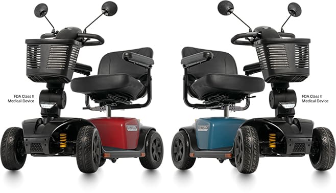Two Victory Platinum 4-Wheel Scooters by Pride Mobility are shown side by side, each with red or blue front panels, black seats, baskets, mirrors, and labeled as FDA Class II Outdoor Mobility Scooters.