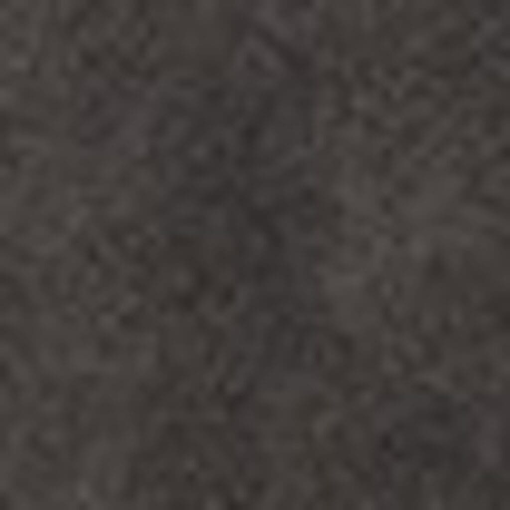A close-up image of a dark, textured surface, likely fabric from the VivaLift Radiance PLR-3955 Lift Chair by Pride Mobility, featuring a slightly uneven pattern with varying shades of gray and black.