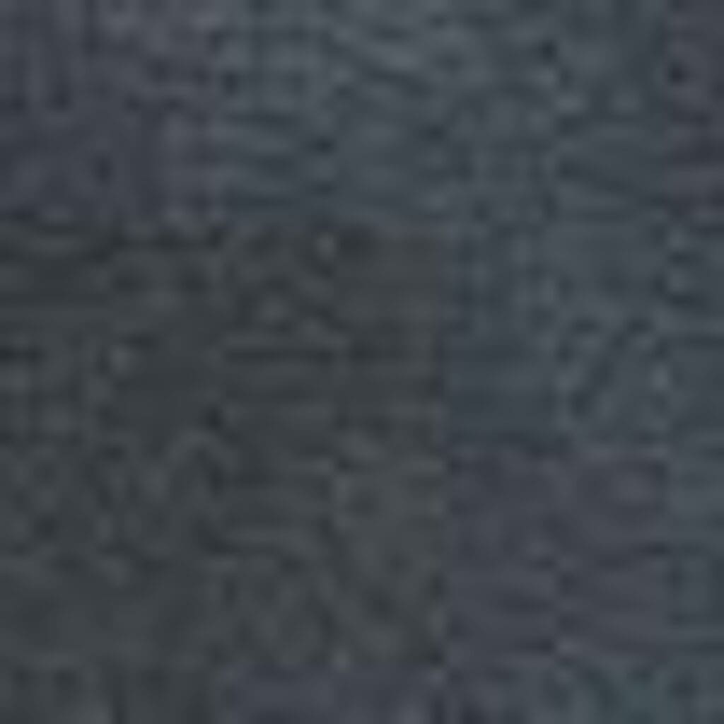 A close-up of a dark gray textured surface, likely fabric from the VivaLift Ultra - PLR-4955 Lift Chair by Pride Mobility, showing subtle shading variations.