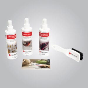 Three spray bottles of Crypton cleaning products, a small cleaning brush, and an informational card are arranged on a plain gray background.