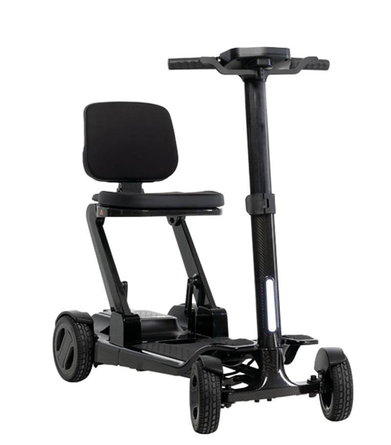 The Go Go Carbon 4-Wheel Scooter by Pride Mobility is a compact, lightweight scooter with a padded seat, backrest, handlebars, and four wheels—ideal for comfortable indoor or outdoor use and easy transport.