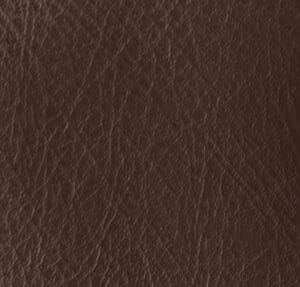 Close-up of a brown leather surface on the Evolution (LC-435) Lift Chair by Pride Mobility, showcasing its fine grain texture and natural wrinkles.