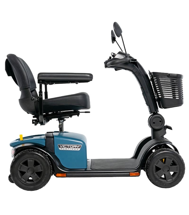 Side view of the blue and black Victory Platinum 4-Wheel Scooter by Pride Mobility, featuring a cushioned seat, armrests, rearview mirrors, and front basket—ideal for seniors needing comfort, stability, and mobility support. Side view of the blue and black Victory Platinum 4-Wheel Scooter by Pride Mobility, featuring a cushioned seat, armrests, rearview mirrors, and front basket—ideal for seniors needing comfort, stability, and mobility support.