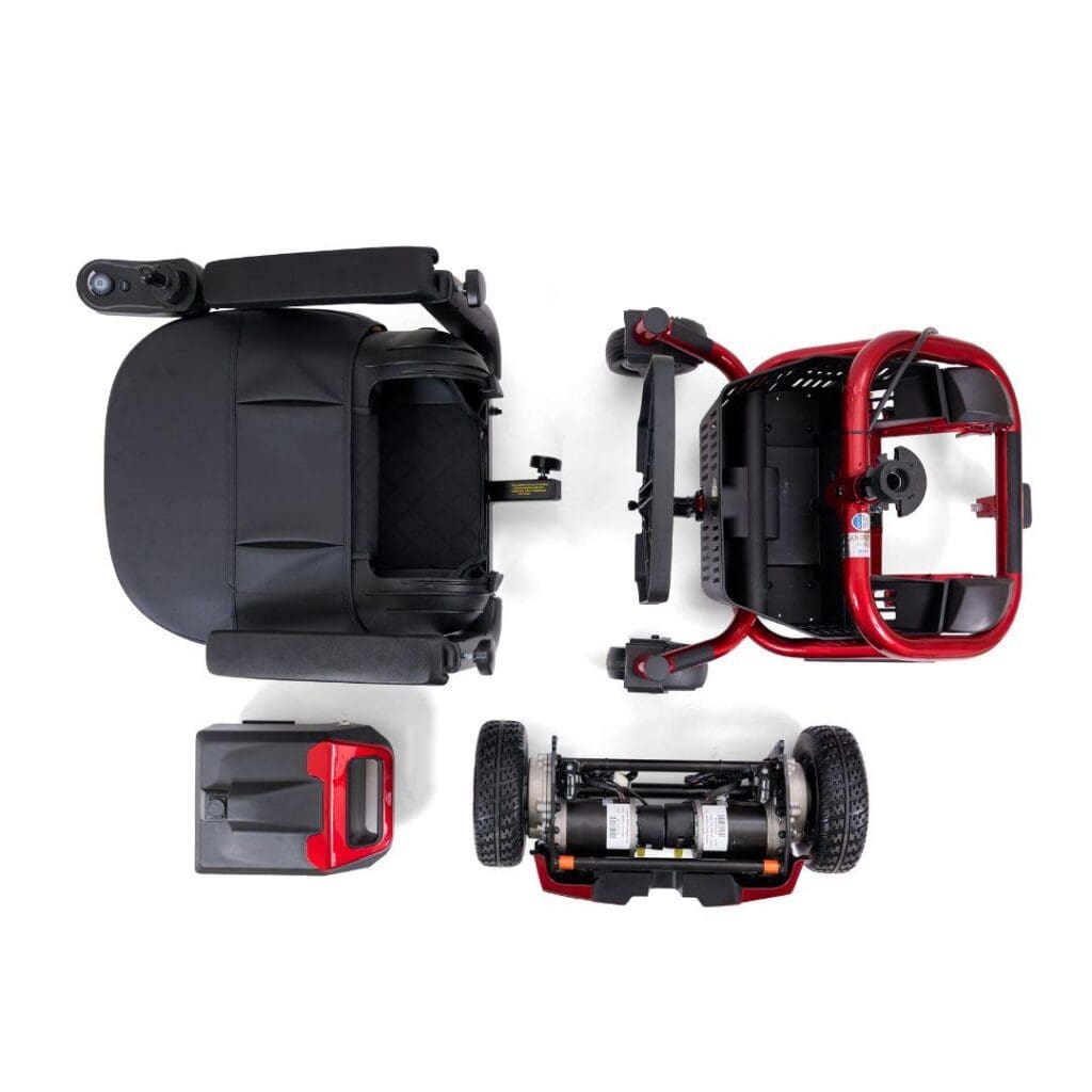 Top-down view of a disassembled LiteRider Envy - Power Wheelchair by Golden, displaying four separate parts: seat, main body with handlebars, battery pack, and rear wheel section, arranged on a white background.