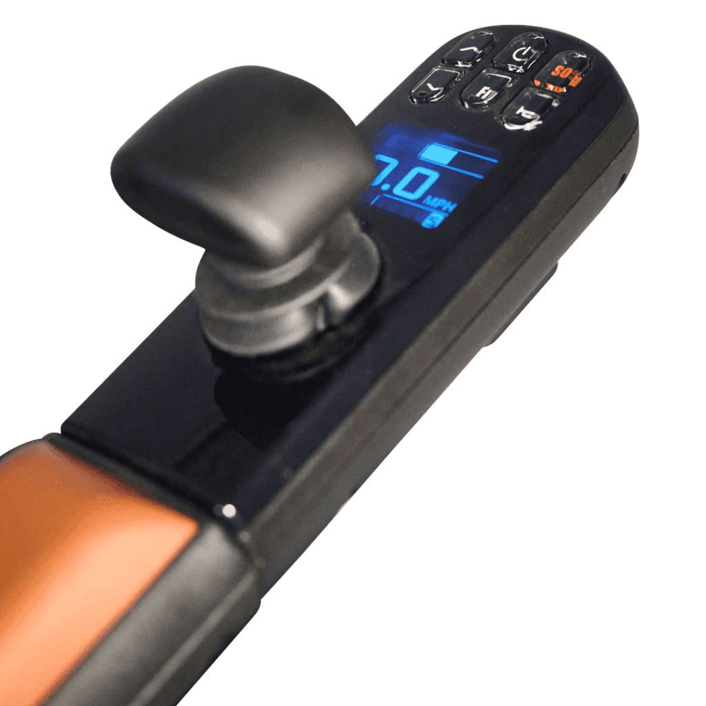 Close-up of the Ally Pro - Power Wheelchair by Golden control panel, featuring a joystick, keypad, and blue digital speed display (MPH). The sleek black panel is highlighted with orange trim for a modern touch.