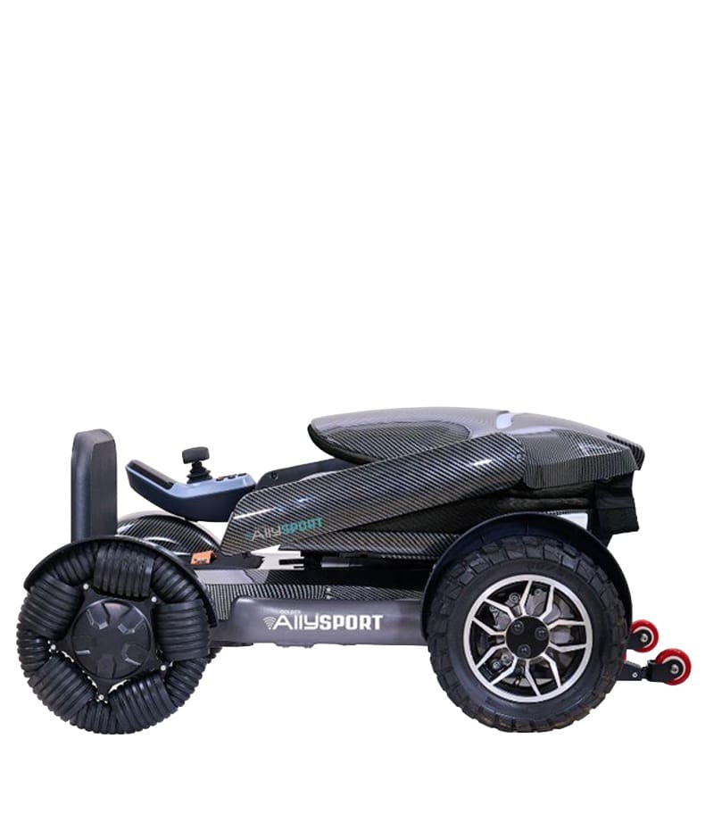 The Ally Sport - Power Wheelchair by Golden is a compact, modern chair with a black, sleek design, large textured wheels, and a cushioned seat. Shown folded for portability, it also showcases its sturdy build. The Ally Sport - Power Wheelchair by Golden is a compact, modern chair with a black, sleek design, large textured wheels, and a cushioned seat. Shown folded for portability, it also showcases its sturdy build.