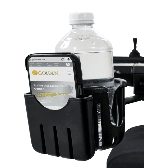 A black cup holder attached to the Ally - Power Wheelchair by Golden holds a clear water bottle and a smartphone displaying the Golden Technologies website.