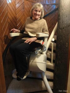 Karen, Ed’s wife, is featured in the award-winning image captured by Ed Buchs, highlighting the beautifully integrated Freecurve stair lift in their home.