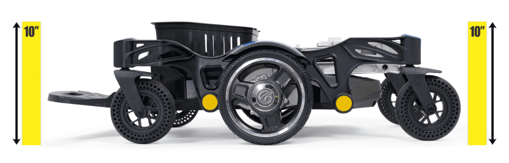 The black, three-wheeled Buzzaround CarryOn Power Wheelchair by Golden stands between two yellow bars marked "10," showing its 10-inch height and compact size, making it as lightweight as a travel power wheelchair.