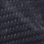 Close-up of a dark, textured carbon fiber surface with a distinctive woven pattern and slightly glossy finish, as featured on the sleek frame of the Ally Sport - Power Wheelchair by Golden.