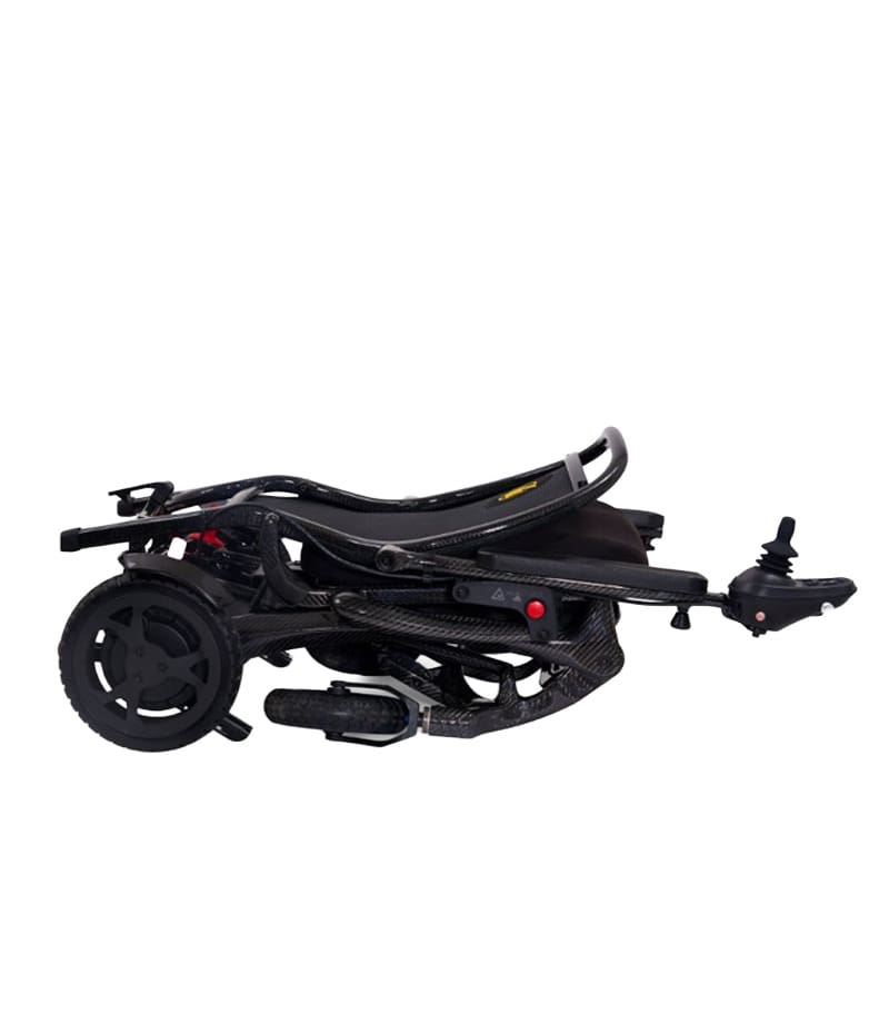 The Cricket - Power Wheelchair by Golden is shown folded, displaying its wheels, footrest, and joystick. Its sleek black design makes this lightweight travel wheelchair highly portable and convenient for on-the-go use.