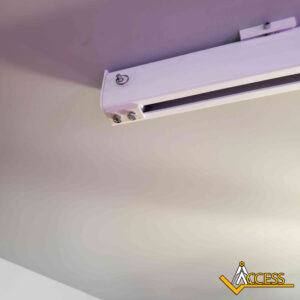 A close-up of a white metal ceiling track attached to a light beige ceiling, with three visible screws and a logo reading ACCESS in the bottom right corner.