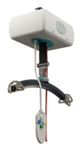 A white Fixed Ceiling Lift by Mackworth features a curved black handle, safety straps, and a handheld remote with colored buttons—designed as a reliable Home Care Lift System for assisting with patient mobility.