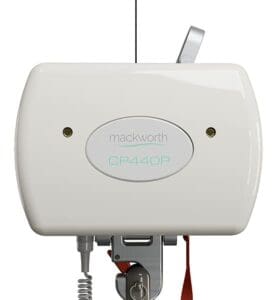 A close-up of a white Portable Ceiling Lift System by Mackworth, featuring a smooth rectangular casing, small sensors or lights, visible lever, coiled cable, and the brand name on the front.
