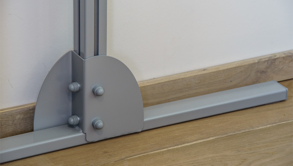 FreedomBridge-SureHands-04 Close-up of a SureHands free-standing ceiling lift support base, showing the sturdy floor-mounted frame designed to provide stable patient transfers without permanent installation.